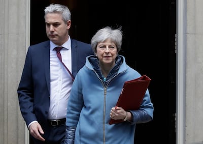 Britain's Prime Minister Theresa May and Brexit Secretary Stephen Barclay leave 10 Downing Street in London, Monday, March 25, 2019. Embattled Prime Minister Theresa May was scrambling Sunday to win over adversaries to her Brexit withdrawal plan as key Cabinet ministers denied media reports that they were plotting to oust her. (AP Photo/Kirsty Wigglesworth)