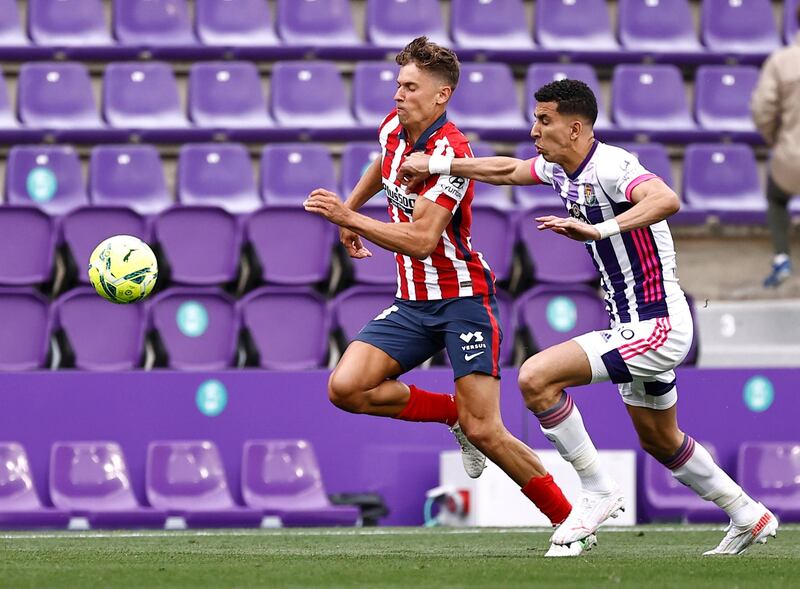 Atletico Madrid's Marcos Llorente with Real Valladolid's Jawad El Yamiq. Reuters