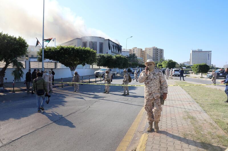 Security forces stand at the site of the headquarters of Libya's foreign ministry after suicide attackers hit in Tripoli, Libya. Reuters