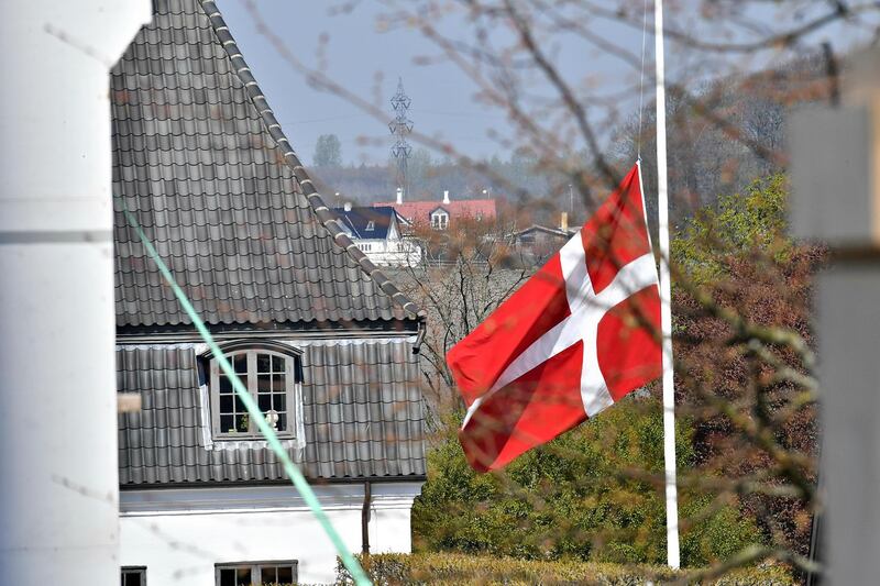 The flag is seen at half mast at Danish billionaire and owner of fashion business Bestseller Anders Holch Povelsen's home south of Aarhus, Denmark. Ernst van Norde / Ritzau Scanpix via AP