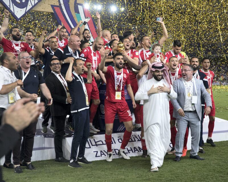 AL AIN, UNITED ARAB EMIRATES - April 18, 2019: Etoile du Sahel celebrates after winning the 2018–19 Zayed Champions Cup, at Hazza bin Zayed Stadium. Seen with HE Turki bin Abdul Mohsen Al Sheikh, Chairman of the General Entertainment Authority of Saudi Arabia (front 2nd R).

( Mohammed Al Bloushi for Ministry of Presidential Affairs )
---