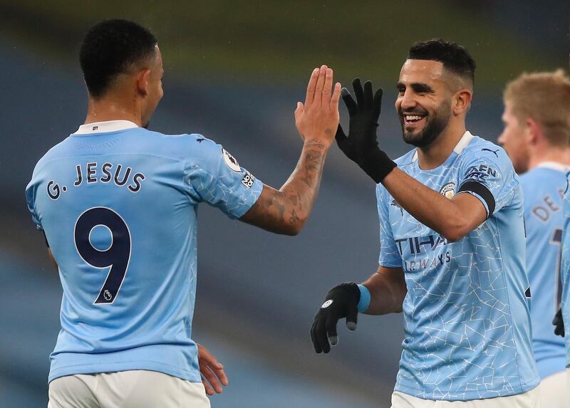 Manchester City's Riyad Mahrez celebrates with Gabriel Jesus after scoring his second goal against Burnley. EPA