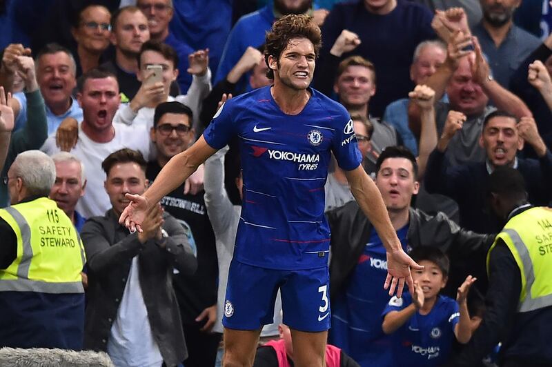 Chelsea's Spanish defender Marcos Alonso celebrates after scoring their third goal during the English Premier League football match between Chelsea and Arsenal at Stamford Bridge in London on August 18, 2018. (Photo by Glyn KIRK / AFP) / RESTRICTED TO EDITORIAL USE. No use with unauthorized audio, video, data, fixture lists, club/league logos or 'live' services. Online in-match use limited to 120 images. An additional 40 images may be used in extra time. No video emulation. Social media in-match use limited to 120 images. An additional 40 images may be used in extra time. No use in betting publications, games or single club/league/player publications. / 