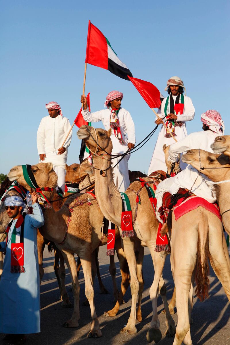 December 02. The Loyalty March down Diyafa Rd to Union House organized by the Dubai Camel Racing Club. December 02, Dubai, United Arab Emirates (Photo: Antonie Robertson/The National)