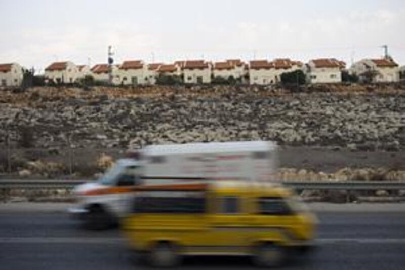 Vehicles move past the Jewish settlement of Ofra, north-east of Ramallah, which won recognition from the Labor government in 1975.