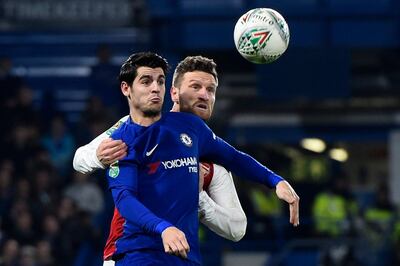 epa06429860 Chelsea's Alvaro Morata (L) and Arsenal's Shkodran Mustafi (R) vie for the ball during the Carabao Cup semi final first leg match between Chelsea and Arsenal at the Stamford Bridge Stadium in London, Britain, 10 January 2018.  EPA/WILL OLIVER No use with unauthorised audio, video, data, fixture lists, club/league logos 'live' services. Online in-match use limited to 75 images, no video emulation. No use in betting, games or single club/league/player publications