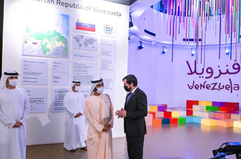 Sheikh Mohammed is given a tour of the Venezuela pavilion.