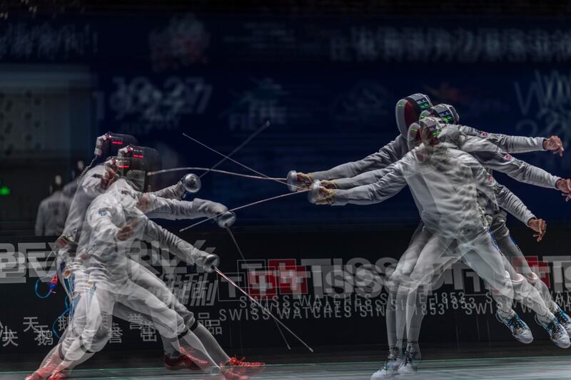 Dmitriy Alexanin of Kazakhstan crosses swords with Yannic Borel from France in the men's Epee qualification at the Fencing World Championships in Wuxi, China. Aleksandar Plavevski/EPA