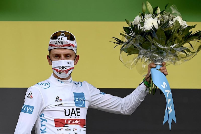 Team UAE Emirates' Tadej Pogacar of Slovenia celebrates his white jersey. AFP