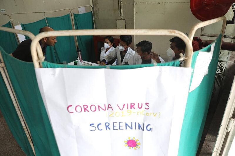 Indian doctors screen patients as a precautionary measure for Coronavirus in Nehru Homoeopathic Medical College and Hospital in New Delhi, India.  EPA