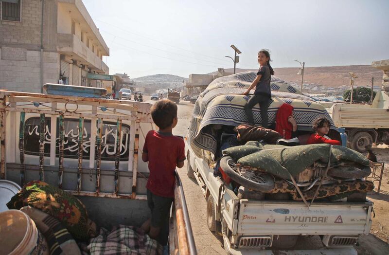 Displaced Syrians who fled from their villages near the village of Jibala in the south of Idlib province to escape bombing by Syrian government forces, return home shortly before a truce fell apart between rebels and President Bashar al-Assad's regime, on August 4, 2019. Damascus resumed air strikes on northwest Syria's Idlib on August 5, a war monitor said, scrapping a ceasefire for the jihadist-run bastion and accusing its opponents of targeting an airbase of its ally Russia. / AFP / Aaref WATAD
