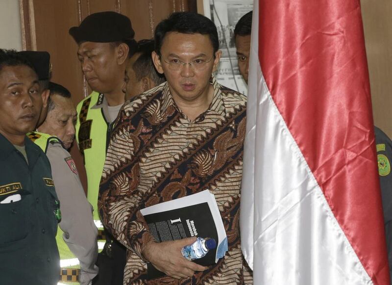 Jakarta governor Basuki Tjahaja Purnama, popularly known as "Ahok", entering the courtroom prior to the start of his trial hearing at North Jakarta district court in Jakarta, Indonesia on December 13, 2016. Tatan Syuflana/AP Photo