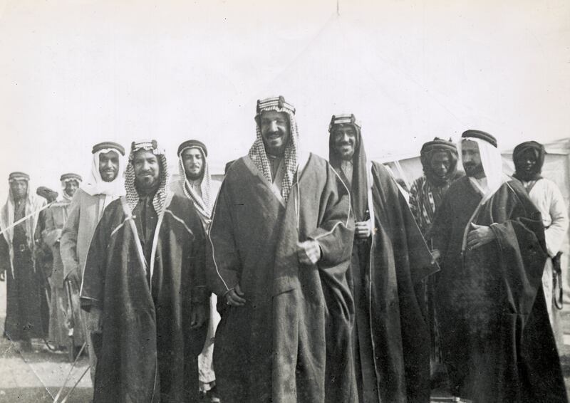 The King and his guests, Shaikh Ahmad al Sabah, Ruler of Kuwait, on his right and Saud, behind him on left, This image shows the King and his guests Shaikh Ahmad al Sabah, Ruler of Kuwait, on his right and Saud, behind on the king's left              Notes on back of print: 'Ahmad of Kuwait. Ibn Saud. Emir Saud ibn Abdul Aziz. Yusil Yassin.', Saudi Arabia, 1934.  (Photo by Gerald de Gaury/Royal Geographical Society via Getty Images)