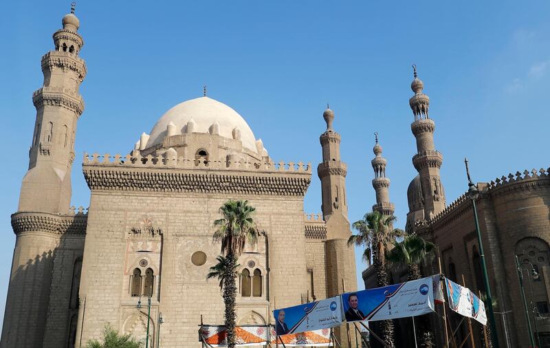 Election campaign posters are pictured outside the Sultan Hassan al-Rifai mosque as Egyptians go to vote on August 11, 2020 for a new senate in an upper house election. The two-day vote for 200 of the Senate's 300 seats will be largely contested by candidates who back President Abdel Fattah al-Sisi, who has quietened most opposition within and outside the legislature.
 / AFP / Khaled DESOUKI

