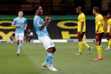 Manchester City's English midfielder Raheem Sterling (2L) celebrates scoring the opening goal during the English Premier League football match between Watford and Manchester City at Vicarage Road Stadium in Watford, north of London on July 21, 2020. RESTRICTED TO EDITORIAL USE. No use with unauthorized audio, video, data, fixture lists, club/league logos or 'live' services. Online in-match use limited to 120 images. An additional 40 images may be used in extra time. No video emulation. Social media in-match use limited to 120 images. An additional 40 images may be used in extra time. No use in betting publications, games or single club/league/player publications. / AFP / POOL / Adrian DENNIS / RESTRICTED TO EDITORIAL USE. No use with unauthorized audio, video, data, fixture lists, club/league logos or 'live' services. Online in-match use limited to 120 images. An additional 40 images may be used in extra time. No video emulation. Social media in-match use limited to 120 images. An additional 40 images may be used in extra time. No use in betting publications, games or single club/league/player publications.