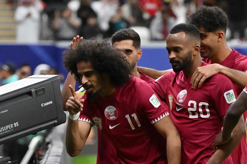 Qatar's Akram Afif celebrates his winner with teammates. AFP