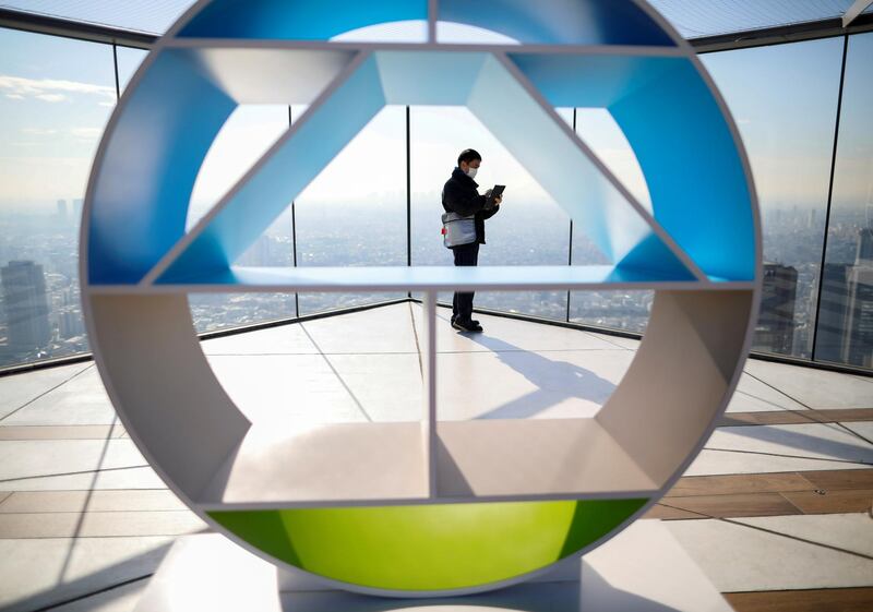 FILE PHOTO: A security guard wearing a protective face mask is seen amid the coronavirus disease (COVID-19) outbreak, at an observation deck in Tokyo, Japan January 22, 2021. REUTERS/Issei Kato/File Photo