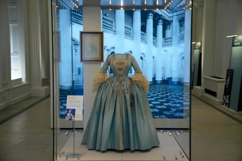 A Georgian-style dress worn by Princess Margaret, the sister of Britain's Queen Elizabeth II, to a charity costume ball in 1964 and created by theatre designer Oliver Messel is displayed in the Royal Style in the Making exhibition at Kensington Palace in London. AP Photo
