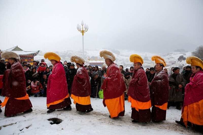Tibetan monks attend a ceremony at the Langmu Lamasery during the 'Sunbathing Buddha Festival'. Reuters