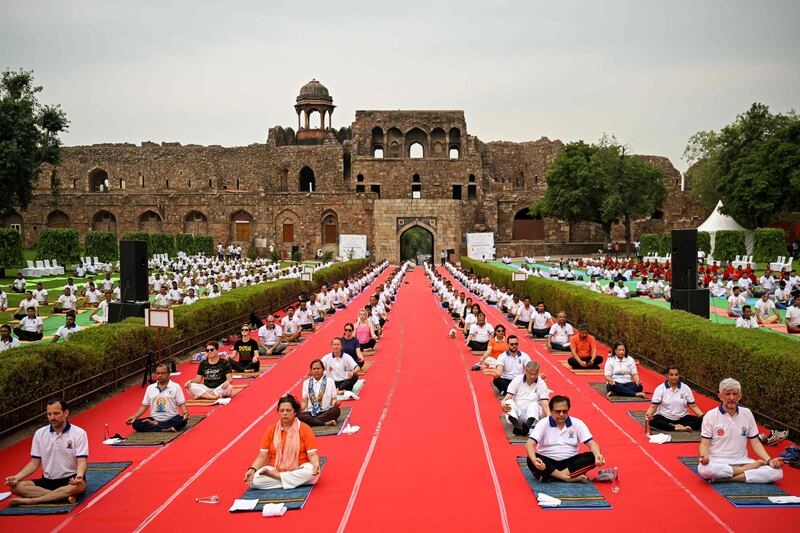 Practitioners take part in a yoga session on the International Day of Yoga, in New Delhi. AFP