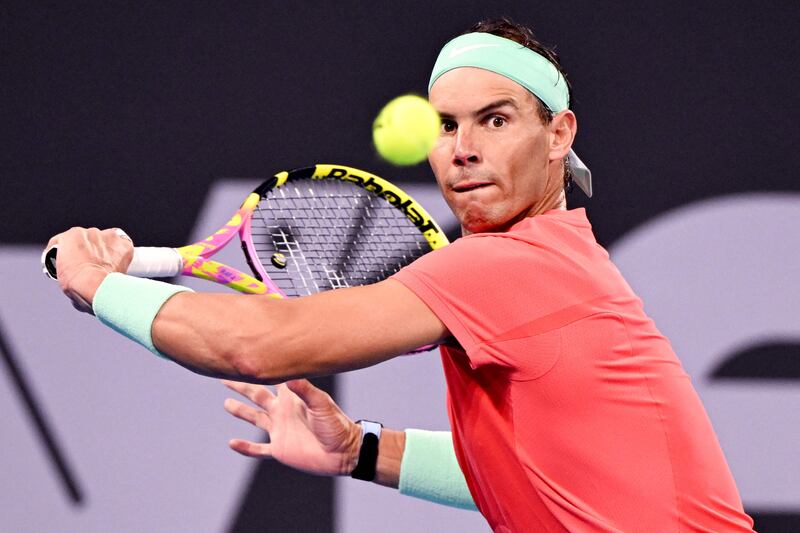 Rafa Nadal hits a return against Dominic Thiem. AFP