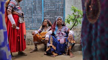 Tribal women wait to cast their votes at a polling station in the Rangareddy district of the southern Telangana state. Reuters