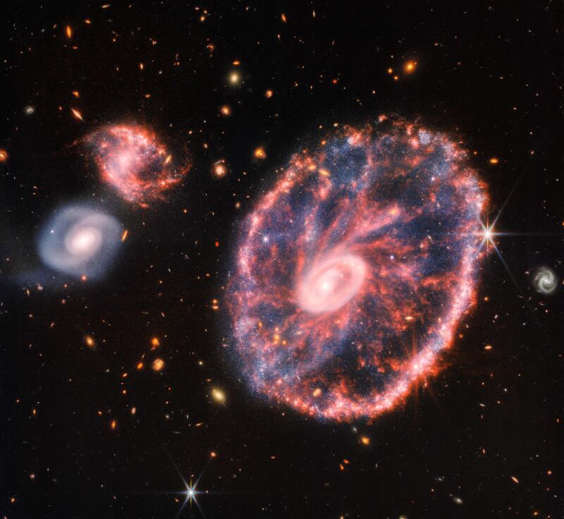 A composite image of the Cartwheel Galaxy captured by the James Webb Space Telescope in August 2022. AFP