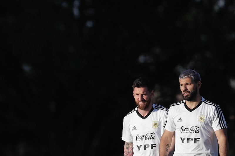 Lionel Messi, left, and Sergio Aguero walk out for training with Argentina. EPA