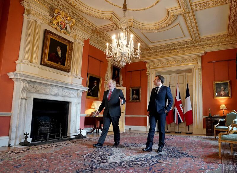 Britain's Prime Minister Boris Johnson welcomes French President Emmanuel Macron to commemorate the 80th anniversary of wartime leader Charles de Gaulle's BBC broadcast to occupied France after the 1940 Nazi invasion, in 10 Downing Street in London. EPA