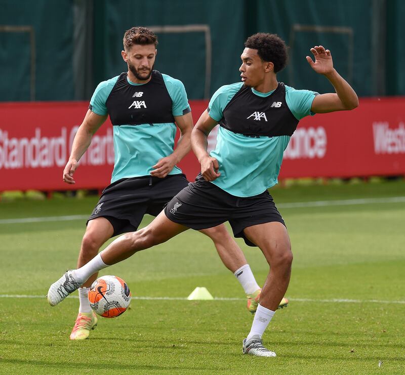 LIVERPOOL, ENGLAND - JULY 24: (THE SUN OUT. THE SUN ON SUNDAY OUT) Adam Lallana of Liverpool with Trent Alexander-Arnold of Liverpool during a training session  at Melwood Training Ground on July 24, 2020 in Liverpool, England. (Photo by John Powell/Liverpool FC via Getty Images)