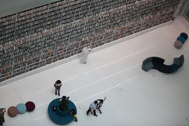 Library goers visit the newly built Mohammed Bin Rashid Library (MBRL) at the Gulf emirate of Dubai, United Arab Emirates, 07 July 2022.  The newly opened seven-stories MBRL with its shape resembling a traditional wooden book stand carrying an open book, contains nine libraries, an amphitheatre, a garden and cafe, and costed some one billion AED (about 268 million euros).  The library is offering over 100,000 books on a broad variety of topics such as health, history, technology and other sciences in addition to numerous digital books in different languages.   EPA / ALI HAIDER  ATTENTION: This Image is part of a PHOTO SET
