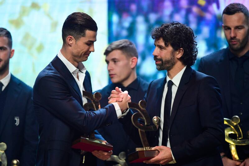 Cristiano Ronaldo receives from President AIC, Damiano Tommasi, the award of best player at Gran Gala del Calcio 2019 ceremony. AFP