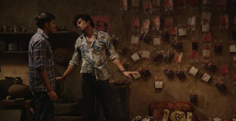 Randeep Hooda, right, stars as a criminal who makes his fortune selling blood illegally. Courtesy of Laal Rang