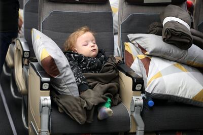 A child on the plane at Al Arish airport in Egypt. Pawan Singh / The National