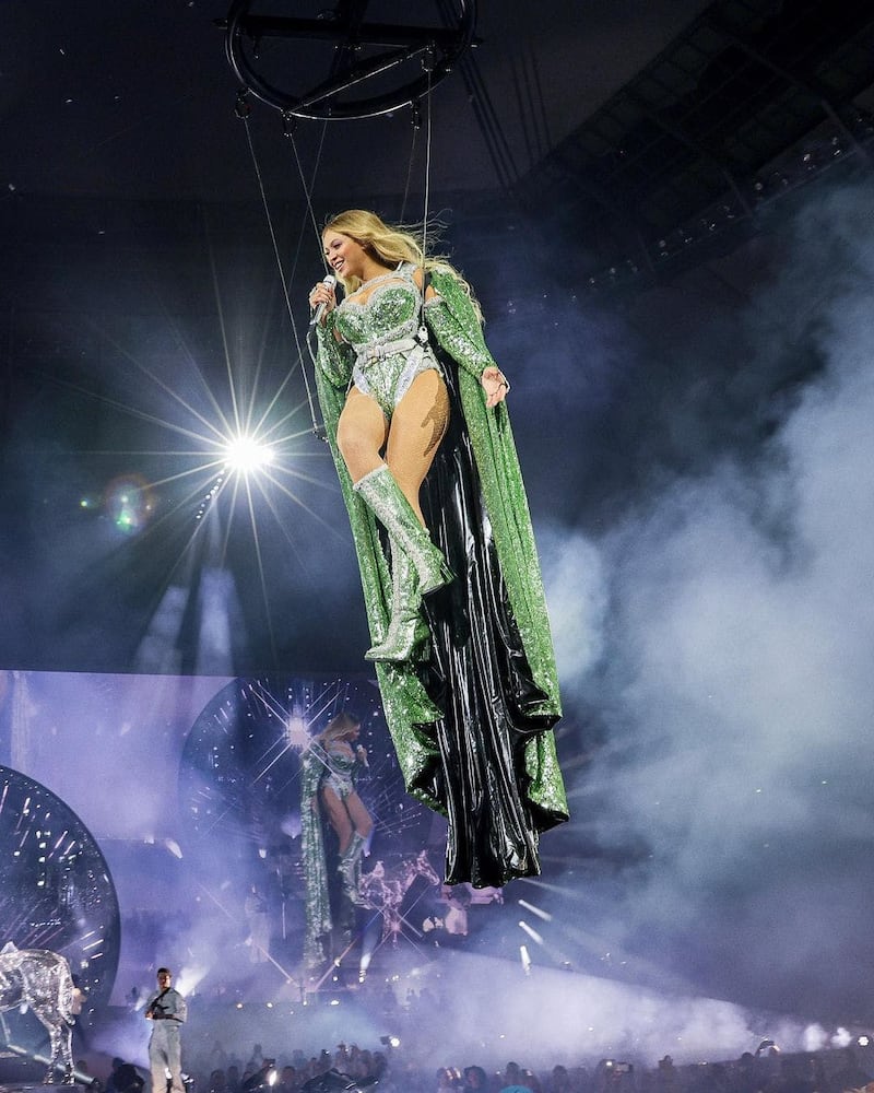 Bodysuit and cape covered in green crystals by Del Core