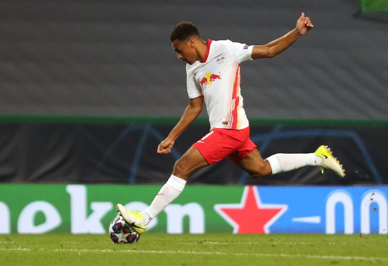 Leipzig's US midfielder Tyler Adams shoots to score his goal during the Champions League quarter-final against Atletico Madrid. AFP