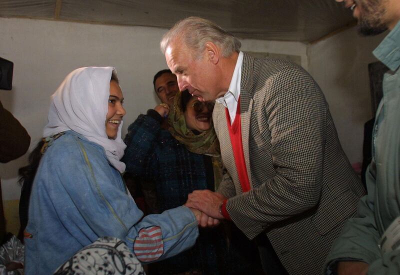399542 03: U.S Senator Joseph Biden,Chairman of the Senate Foreign Relations Committee meets a female student at Ariana High school January 12, 2002 during his visit to Kabul, Afghanistan. (Photo by Paula Bronstein/ Getty Images)