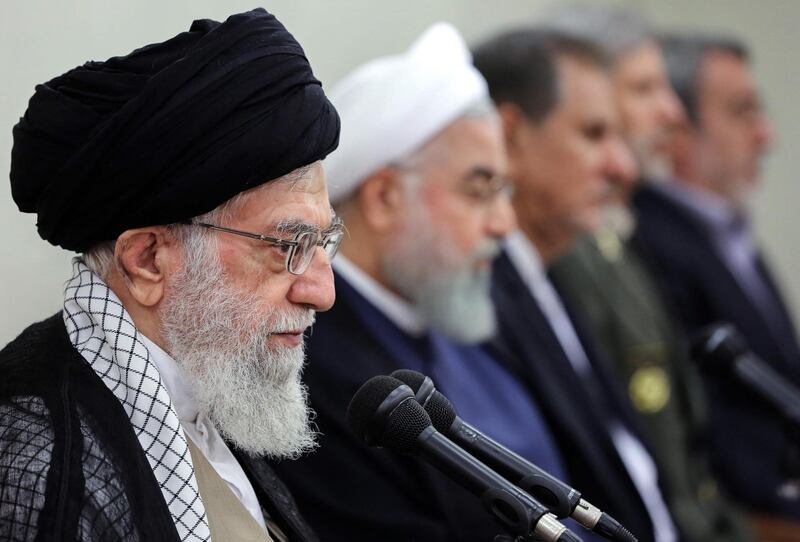 A handout picture provided by the office of Iran's supreme leader Ayatollah Ali Khamenei on August 29, 2018, shows Khamenei (L) speaking during a government meeting in the capital Tehran. To his right is President Hassan Rouhani - Iran's parliament declared its dissatisfaction with President Hassan Rouhani yesterday, voting to reject his answers after grilling him over the deteriorating economy. 
Despite the impeachment of two of his ministers, Rouhani himself is protected by supreme leader Ayatollah Ali Khamenei, who said recently that removing the president would "play into the hands of the enemy". (Photo by Handout / KHAMENEI.IR / AFP) / XGTY / === RESTRICTED TO EDITORIAL USE - MANDATORY CREDIT "AFP PHOTO / HO / KHAMENEI.IR" - NO MARKETING NO ADVERTISING CAMPAIGNS - DISTRIBUTED AS A SERVICE TO CLIENTS ===