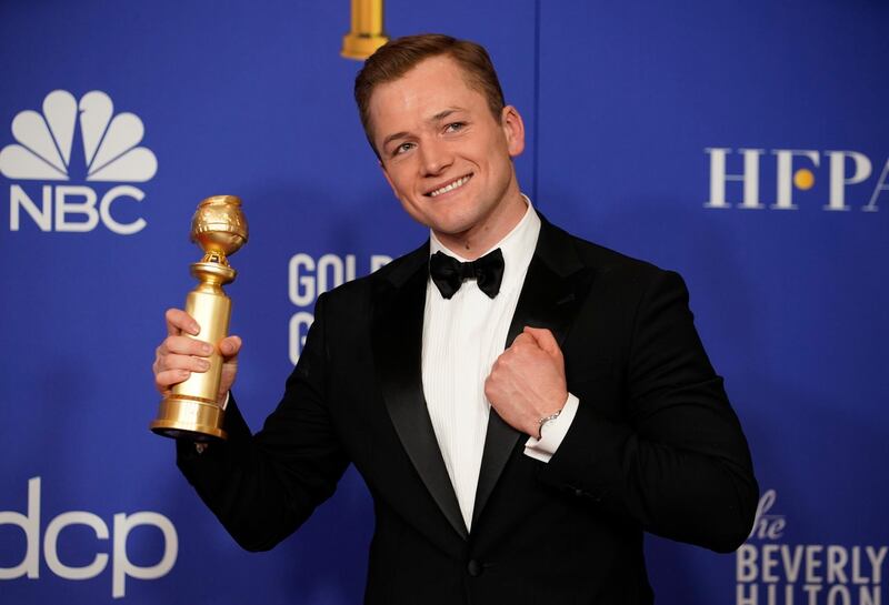 Taron Egerton poses with his award for Best Performance by an Actor in a Motion Picture - Musical or Comedy for his role in 'Rocketman' during the 77th annual Golden Globe Awards on January 5, 2020, at The Beverly Hilton hotel in Beverly Hills, California. Reuters