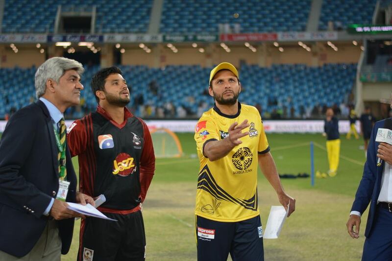 Shahid Afridi flips the coin at the start of Saturday's Pakistan Super League T20 match between his team Peshawar Zalmi and Lahore Qalandars, Photo Courtesy / PSL