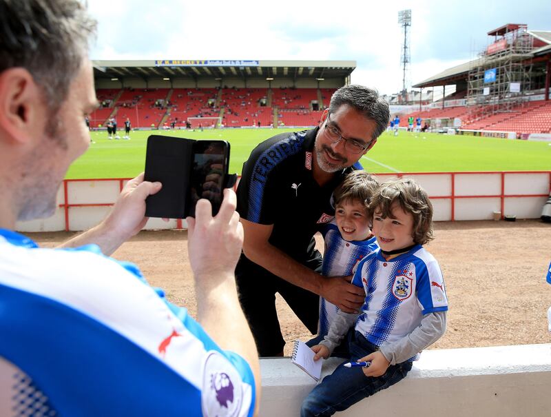 BARNSLEY, ENGLAND - JULY 22:  David Wagner manager of Huddersfield Town poses for photos with the fans during the pre season friendly against Barnsley at Oakwell Stadium on July 22, 2017 in Barnsley, England. (Photo by Clint Hughes/Getty Images)