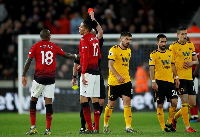 Manchester United's Ashley Young is shown a red card. Reuters