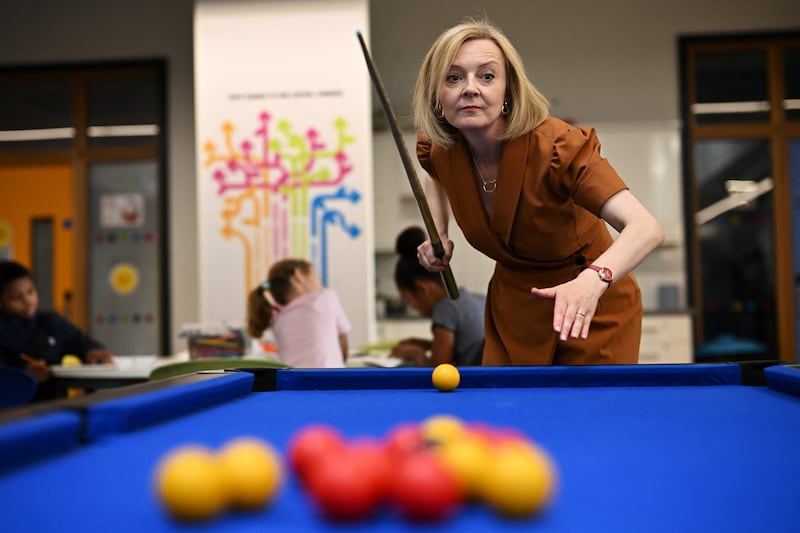 Liz Truss playing pool during a visit to the Onside Future Youth Zone in London in August 2022. PA
