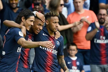 Paris Saint-Germain's Kylian Mbappe, centre, with Neymar, right, and Edinson Cavani. AFP