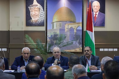 Palestinian Prime Minister Mohammad Mustafa, centre, talks to officials in the aftermath of the Israeli raid. AFP
