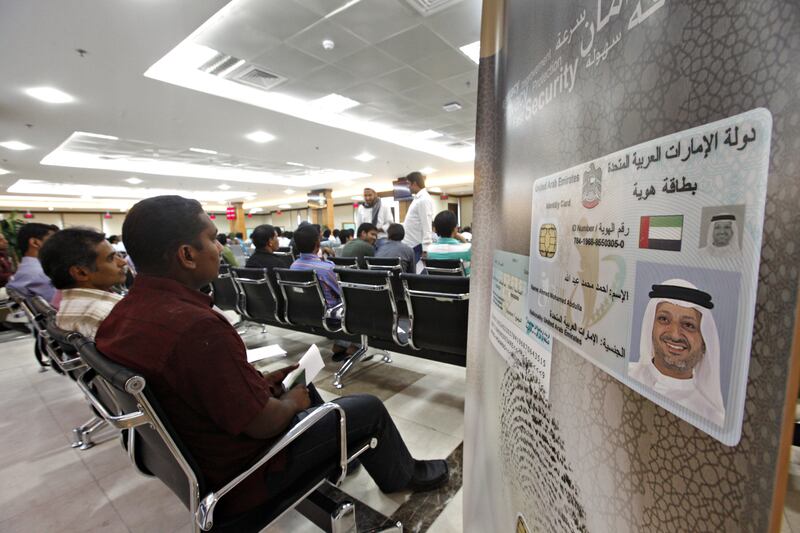 DUBAI, UNITED ARAB EMIRATES - May 27, 2012 - People wait to be fingerprinted and photographed during the registration process for their Emirates ID card at the Emirates ID Authority in Al Barsha in Dubai City, Dubai, May 27, 2012. Some people had been waiting for an hour to register. (Photo by Jeff Topping/The National) 
