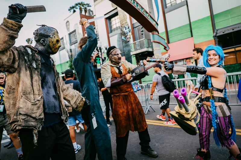 Cosplayer dressed as Jason, Michael Myers and Leatherface.  Getty Images