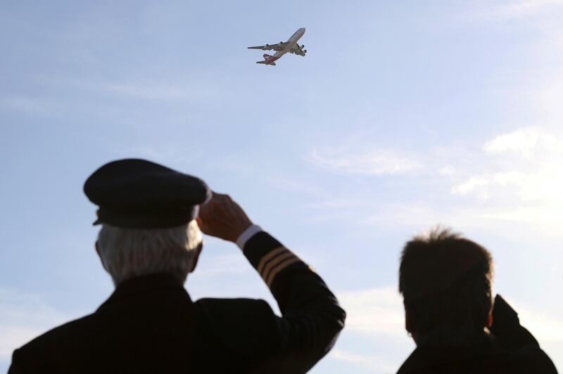 People watch the last Qantas 747 jet depart Sydney Airport as Qantas retires its remaining Boeing 747 planes early. Reuters