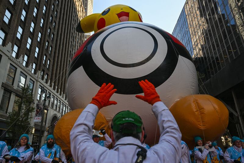 Balloon handlers deflate the balloons after. The annual Macy’s parade includes 16 giant character balloons, 28 floats, and 12 marching bands. AFP