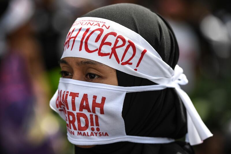 A protester wears headbands reading "No to Icerd" during a rally organised by Muslim politicians against the signing of the UN anti-discrimination convention (ICERD) at Merdeka Square in Kuala Lumpur.  AFP